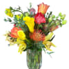 A modern and luxurious arrangement that blends exotic elegance with vivid color.
