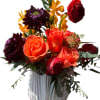 A fiery composition of color and texture. Intense orange roses and gold