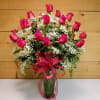 Two Dozen Red Roses featuring 24 Long-stemmed red roses elegantly displayed in