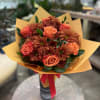 A celebration of fall&rsquo;s golden palette. This hand-tied arrangement features rich orange