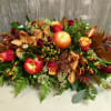 Stunning and grand long and low Thanksgiving table piece, with apples, cymbidium