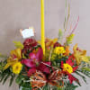 Thanksgiving centerpiece featuring an assortment of fall flowers arranged in a floral