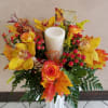Thanksgiving centerpiece featuring an assortment of fall flowers arranged in a floral