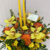 Thanksgiving centerpiece featuring an assortment of fall flowers arranged in a floral