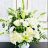 As serene as gently falling snow, this elegant white arrangement in a