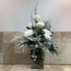 A beautifully designed arrangement that&rsquo;s perfect for any winter celebration. Snow white