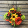 Fall colored cube filled with designers choice of seasonal fall flowers perfect