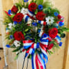 Honor a loved ones memory with this elegant red, white and blue