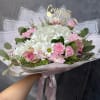 A timeless arrangement featuring white hydrangeas, soft pink roses, delicate carnations, and