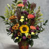 Celebrate the cozy charm of autumn with a whimsical mix of sunflowers