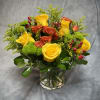 A vibrant and lively arrangement of yellow and orange roses , lime