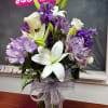 Our White and Purple Elegance Vase showcases a harmonious mix of pristine