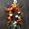 Long and Low Centerpiece with Roses, Mums, Pods, Pheasant Feathers, Magnolia Leaves