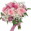 A nosegay bouquet is a small, handheld bouquet, typically featuring a round