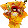 A vibrant handmade crochet bouquet featuring adorable cartoon and animal dolls, arranged