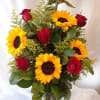 This beautiful arrangement of roses, sunflowers surrounded by solidago and greens is