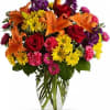 Start the party with a spectacular blend of red roses, orange lilies