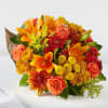 Traditional Cornucopia with orange lilies, mums and roses with filler 