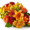 Bursting with bold fall lilies, roses, and mums - this impressive cornucopia