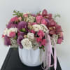A timeless composition of Roses, Spray Roses, Cymbidium Orchids, and delicate fillers