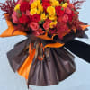 A bold hand-tied bouquet rich with Roses, Spray Roses, Cymbidium Orchids, and