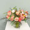 Soft romance meets timeless elegance in this lush garden-style arrangement. Featuring peach