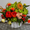 Fresh floral arrangement in ceramic container. It&#039;s great for the season!