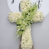 This cross is made with beautiful white roses with an extravagant display