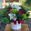 This cheerful holiday arrangement is sure to brighten anyone&#039;s day.
Tax free. Same