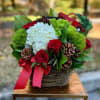 A sweet Christmas basket filled with hydrangea, roses and pinecones.
Tax free. Same