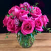 12 premium hot pink roses in a low and lush style! Perfect