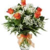 6 Roses with greenery baby&#039;s breath and fern in a vase. The
