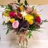 Arrangement of pink, yellow and orange rose with pink lily and yellow