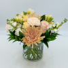 Maman features Peach Chrysanthemums, Blush Roses, Peach Spray Roses, White Stock, White