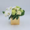 Clare is a petite arrangement of Green and White Roses, White Spray