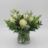 Emerald Isle features White Roses, Bells of Ireland, White Freesia, Green Hypericum