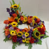 Brilliant burst of color. Orange and Lavender Roses. Orange
Lily&rsquo;s, Red Carnations and