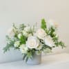 A timeless white arrangement with soft whites, airy design and natural textures.