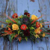A delightful combination of our fall favorites arranged in a centerpiece. Designed