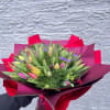 Fresh cut tulips arranged in hand wrapped bouquets.  Please call for
