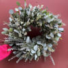 Celebrate the season with a beautiful hand made wreath full of eucalyptus.