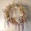 This beautiful wreath is fully dried and artfully crafted in store by