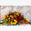 Brimming with the vibrant hues of autumn, this centerpiece showcases a harmonious