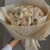 Soft-spoken elegance. A bouquet of premium blush ranunculus wrapped in muted ivory