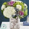  Our luxurious arrangement brings together a colorful mix of blooms to