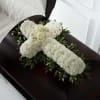 The Peaceful Memories Casket Spray is a gorgeous way to commemorate the