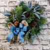 A charming 12-inch artificial wreath, featuring soft blue hues that evoke a