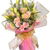 Bursting with joy, this loose‑wrapped bouquet combines light pink roses, vibrant pink