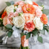 This bridal bouquet features hues of peachs, pinks and whites. Truly elegant