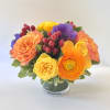 An exquisite and modern styled arrangement of our brightest colored blooms from